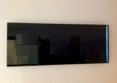 Commande murale noire pour gestion éclairage et climatisation, finition discrète de la rénovation électrique fb électricité